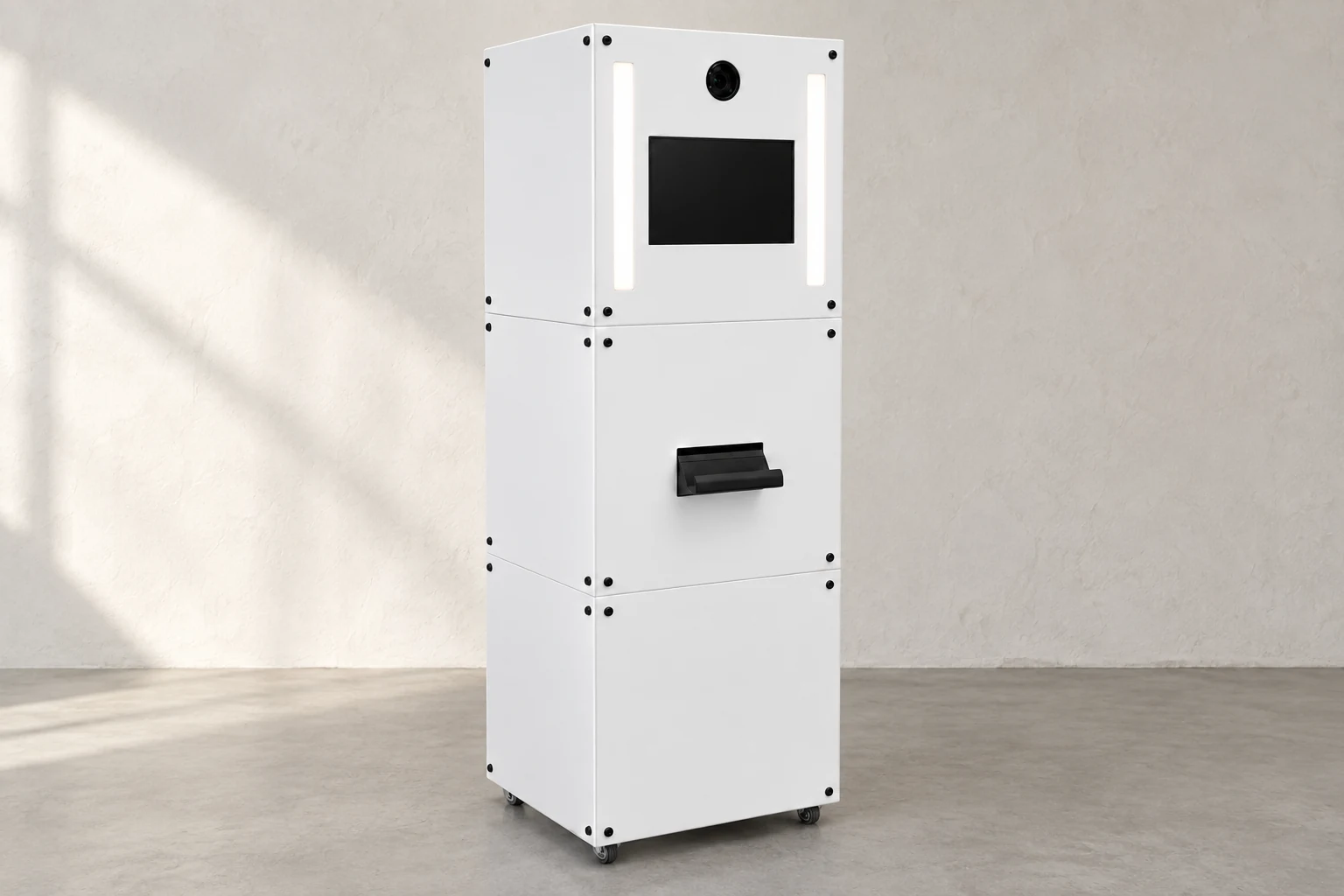 The original white Moment Box booth, with camera, twin lights, touchscreen and print catch